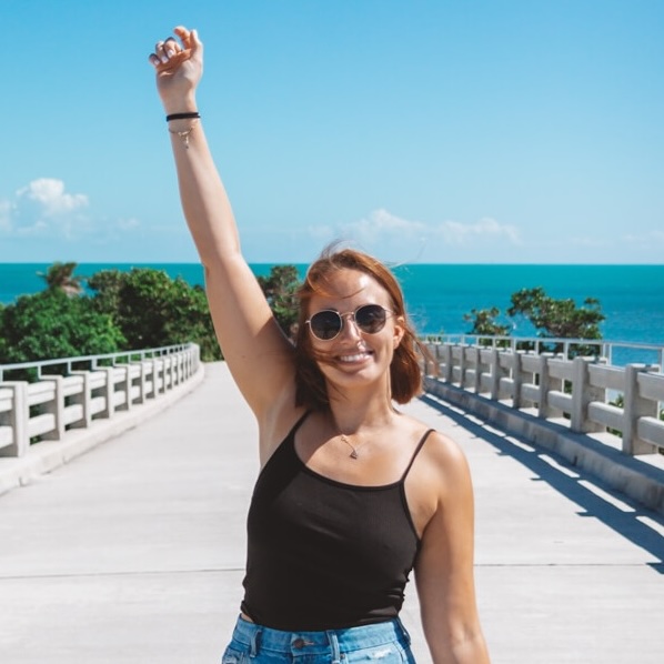 girl with arms in the air in Florida copy