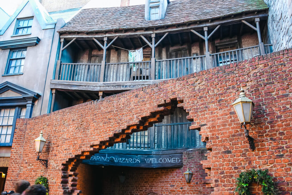 brick archway in front of building facade. this is the exit of Diagon Alley in Harry Potter World