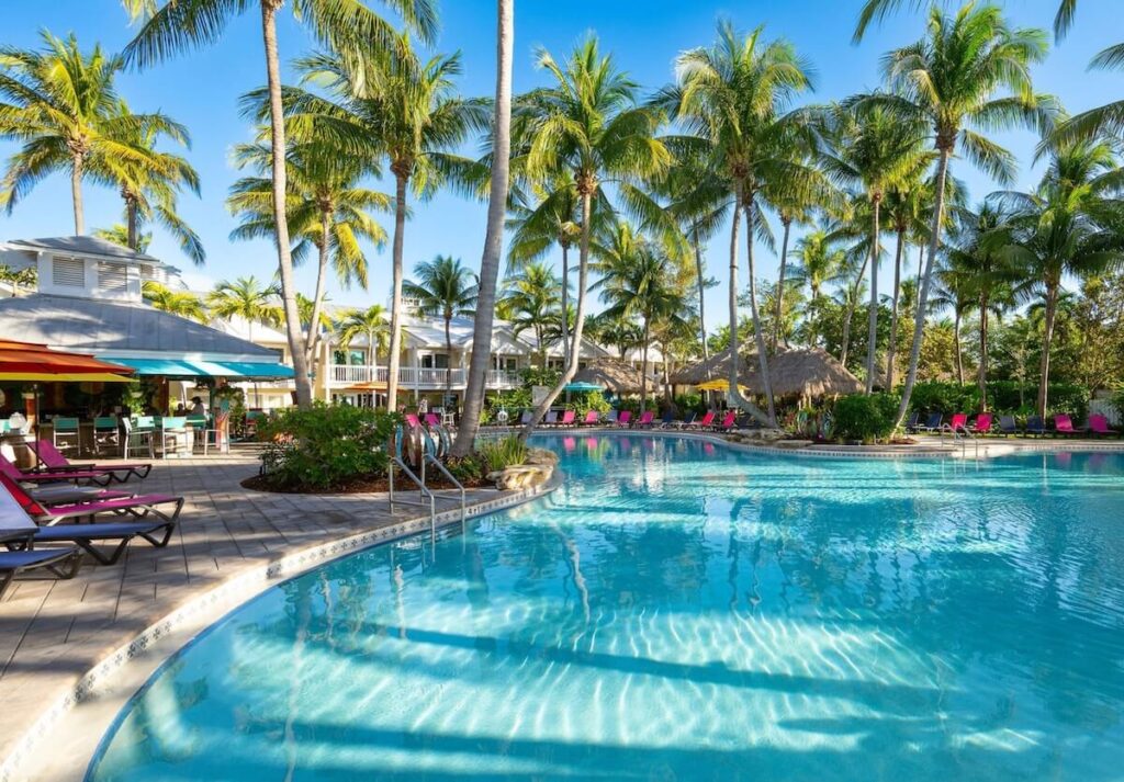 pool with beach chairs and bar next to it at the Havana Cabana Resort in Key West Florida