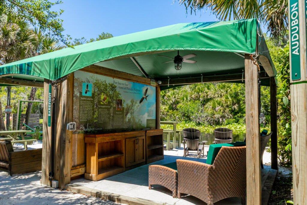 Barefoot and Audubon cabanas at Wekiva Island with green canopies and riverfront seating