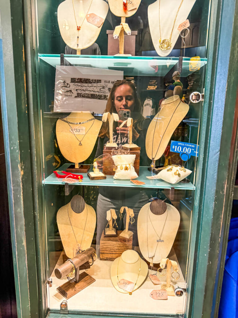 display of necklaces in a green case inside the souvenir shop of Islands of Adventure